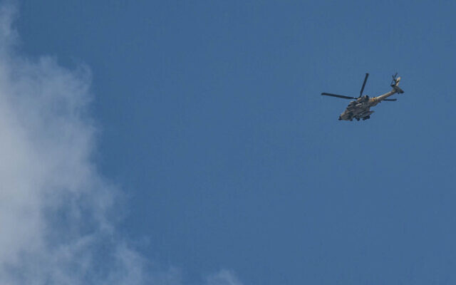 An Israeli army helicopter flies above Jenin in the West Bank during a raid on August 31, 2024. (Ronaldo Schemidt/AFP) An Israeli army helicopter flies above Jenin in the West Bank during a raid on August 31, 2024. (Ronaldo Schemidt/AFP)