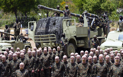 Gunmen from the Lebanese terror group Hezbollah carry out a training exercise in Aaramta village in the Jezzine District, southern Lebanon, May 21, 2023. (AP Photo/Hassan Ammar, File)