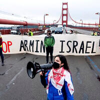 Aysha Abraibesh leads a chant while pro-Palestinian, anti-Israel demonstrators block commute traffic on the Golden Gate Bridge on February 14, 2024, in San Francisco. (AP Photo/Noah Berger)