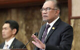 Malaysian Prime Minister Anwar Ibrahim delivers his speech during a press conference at Japan National Press Club in Tokyo Friday, May 24, 2024. (AP Photo/Eugene Hoshiko)