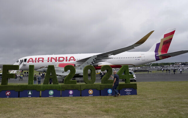 An Air India Airbus A350 stands on the tarmac, at the Farnborough International Air Show in Farnborough, England, July 22, 2024. (AP Photo/ Alberto Pezzali)