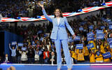 US Vice President Kamala Harris waves during a campaign rally in Atlanta, Georgia, July 30, 2024. (AP Photo/John Bazemore)