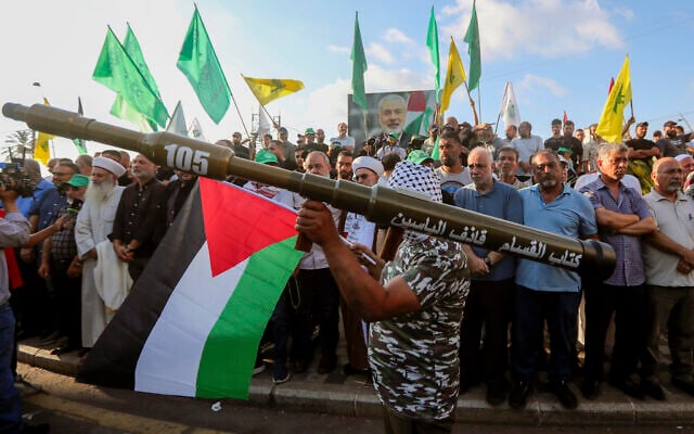 A supporter of the Iran-backed Hezbollah and Hamas terror groups holds a mock rocket at a protest to condemn the killing of Hamas leader Ismail Haniyeh, July 31, 2024, in the southern port city of Sidon, Lebanon. (AP Photo/Mohammed Zaatari) A supporter of the Iran-backed Hezbollah and Hamas terror groups holds a mock rocket at a protest to condemn the killing of Hamas leader Ismail Haniyeh, July 31, 2024, in the southern port city of Sidon, Lebanon. (AP Photo/Mohammed Zaatari)