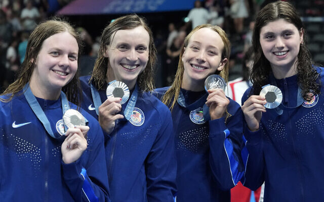 L-R: Erin Gemmel, Katie Ledecky, Paige Madden and Claire Weinstein; The United States' women's 4x200-meter freestyle relay team pose with their silver medals at the 2024 Summer Olympics, Thursday, Aug. 1, 2024, in Nanterre, France. (AP Photo/Matthias Schrader) L-R: Erin Gemmel, Katie Ledecky, Paige Madden and Claire Weinstein; The United States' women's 4x200-meter freestyle relay team pose with their silver medals at the 2024 Summer Olympics, Thursday, Aug. 1, 2024, in Nanterre, France. (AP Photo/Matthias Schrader)