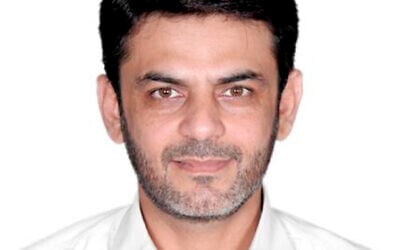 This image provided by the Justice Department, contained in the complaint supporting the arrest warrant, shows Asif Merchant. (Justice Department via AP) This image provided by the Justice Department, contained in the complaint supporting the arrest warrant, shows Asif Merchant. (Justice Department via AP)