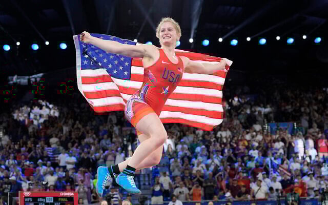 United States' wrestler Amit Elor celebrates after defeating Kyrgyzstan's Meerim Zhumanazarova during their women's freestyle 68kg wrestling final match, at Champ-de-Mars Arena, during the 2024 Summer Olympics, Aug. 6, 2024, in Paris, France. (AP Photo/Eugene Hoshiko)