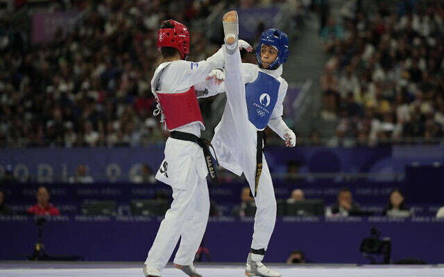 Israel's Avishag Semberg competes with Saudi Arabia's Dunya Ali M Abutaleb in a women's 49kg Taekwondo match during the 2024 Summer Olympics, at the Grand Palais, Aug. 7, 2024, in Paris, France. (AP/Andrew Medichini)