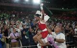 Algeria's Imane Khelif celebrates after defeating China's Yang Liu to win gold in their women's 66kg final boxing match at the 2024 Summer Olympics, August 9, 2024, in Paris, France. (AP Photo/Ariana Cubillos)