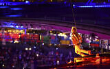 Actor Tom Cruise jumps off the roof of the Stade de France, during the closing ceremony of the 2024 Summer Olympics, at the Stade de France, August 11, 2024, in Saint-Denis, France. (Fabrizio Bensch/Pool Photo via AP)