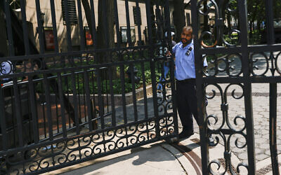 A Columbia University worker closes one of the gates at the Columbia University Campus in New York, Aug. 15, 2024. (AP/Eduardo Munoz Alvarez)