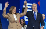 US President Joe Biden, right, clasps the hand of his vice president Kamala Harris, the Democratic presidential nominee, at the Democratic National Convention in Chicago, Illinois, August 19, 2024. (AP Photo/Jacquelyn Martin)