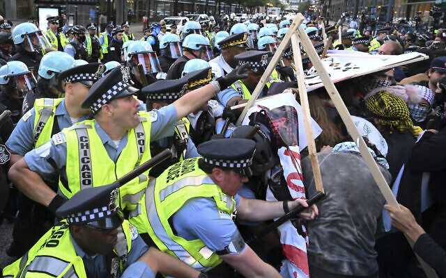 Pro-Palestinian demonstrators clash with police near the Israeli consulate during the Democratic National Convention, on August 20, 2024, in Chicago. (AP Photo/Noah Berger) Pro-Palestinian demonstrators clash with police near the Israeli consulate during the Democratic National Convention, on August 20, 2024, in Chicago. (AP Photo/Noah Berger)