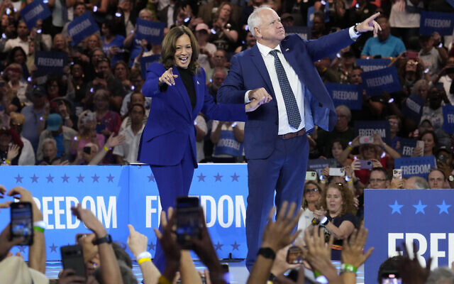 Democratic presidential nominee Vice President Kamala Harris and running mate Minnesota Gov. Tim Walz appear at the Fiserv Forum during a campaign rally in Milwaukee, Tuesday, Aug. 20, 2024. (AP Photo/Jacquelyn Martin)