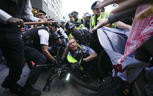 Demonstrators clash with police near the Israeli Consulate during the Democratic National Convention, August 20, 2024, in Chicago. (AP Photo/Julio Cortez) Demonstrators clash with police near the Israeli Consulate during the Democratic National Convention, August 20, 2024, in Chicago. (AP Photo/Julio Cortez)