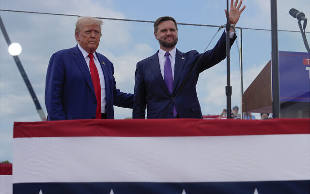 Republican presidential nominee former President Donald Trump and Republican vice presidential nominee Sen. JD Vance, R-Ohio, stand on stage at a campaign rally at North Carolina Aviation Museum, Wednesday, August 21, 2024, in Asheboro, North Carolina. (AP Photo/Julia Nikhinson) Republican presidential nominee former President Donald Trump and Republican vice presidential nominee Sen. JD Vance, R-Ohio, stand on stage at a campaign rally at North Carolina Aviation Museum, Wednesday, August 21, 2024, in Asheboro, North Carolina. (AP Photo/Julia Nikhinson)