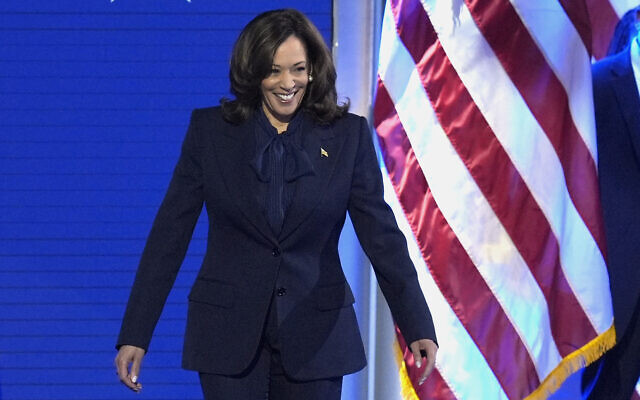 Democratic presidential nominee US Vice President Kamala Harris walks on stage to speak during the Democratic National Convention August 22, 2024, in Chicago. (AP Photo/J. Scott Applewhite) Democratic presidential nominee US Vice President Kamala Harris walks on stage to speak during the Democratic National Convention August 22, 2024, in Chicago. (AP Photo/J. Scott Applewhite)