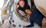Astronauts Butch Wilmore, left, and Suni Williams pose inside the vestibule between the International Space Station's Harmony module and Boeing's Starliner spacecraft on June 13, 2024. (NASA via AP)