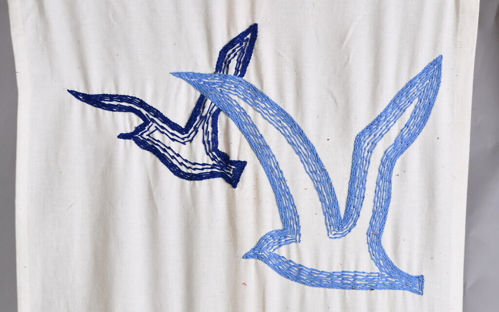 A detail from the flag of first graders featuring a seagull, rescued at Kibbutz Be'eri, southern Israel, December 6, 2024. (Sarit Uziely)