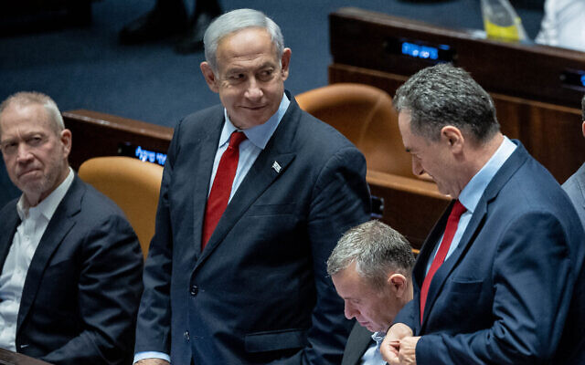 Prime Minister Benjamin Netanyahu, center, Defense Minister Yoav Gallant, left, and Energy Minister Israel Katz, right, at the Knesset plenum in Jerusalem, May 23, 2023. (Yonatan Sindel/Flash90) Prime Minister Benjamin Netanyahu, center, Defense Minister Yoav Gallant, left, and Energy Minister Israel Katz, right, at the Knesset plenum in Jerusalem, May 23, 2023. (Yonatan Sindel/Flash90)