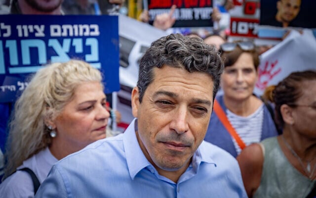 Diaspora Affairs Minister Amichai Chikli with evacuated residents of northern Israel and families of Israelis who were killed since Oct. 7 protest against a hostages-for-ceasefire deal with Hamas, outside the Prime Minister's Office in Jerusalem, July 14, 2024. (Yonatan Sindel/Flash90) Diaspora Affairs Minister Amichai Chikli with evacuated residents of northern Israel and families of Israelis who were killed since Oct. 7 protest against a hostages-for-ceasefire deal with Hamas, outside the Prime Minister's Office in Jerusalem, July 14, 2024. (Yonatan Sindel/Flash90)