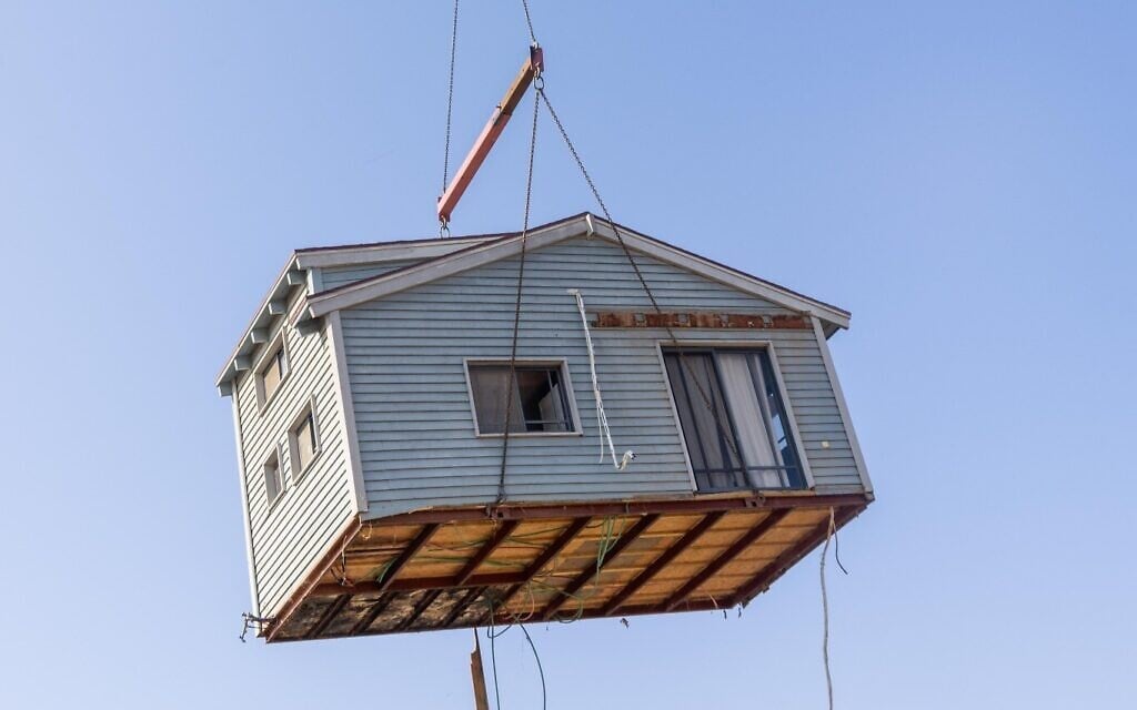 A section of a prefabricated house is moved by crane in Israel, July 19, 2024. (Yossi Aloni/FLASH90) A section of a prefabricated house is moved by crane in Israel, July 19, 2024. (Yossi Aloni/FLASH90)