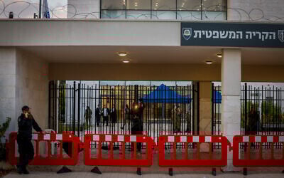 Police guard a military court at the Beit Lid base in central Israel, during a protest against the detention of Israeli reserve soldiers suspected of abusing a Palestinian detainee, July 30, 2024. (Chaim Goldberg/ Flash90)