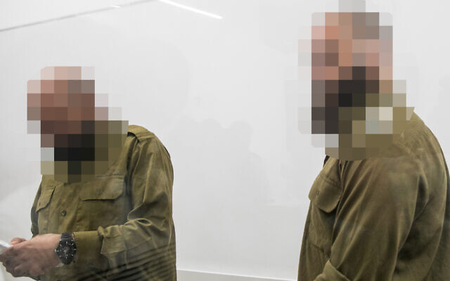 IDF reserve soldiers suspected of sexually abusing a Palestinian detainee at the Sde Teiman detention facility attend a hearing at the Beit Lid military court, August 6, 2024. (Miriam Alster/Flash90)