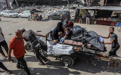 Palestinians seen with their belongings after fleeing from eastern prat of Khan Yunis, in the southern Gaza Strip, on August 9, 2024. (Abed Rahim Khatib/Flash90)