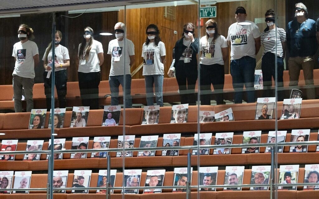 Families and supporters of Israelis held hostage by Hamas terrorists in Gaza protest in the Knesset, August 14, 2024. (Chaim Goldberg/Flash90)