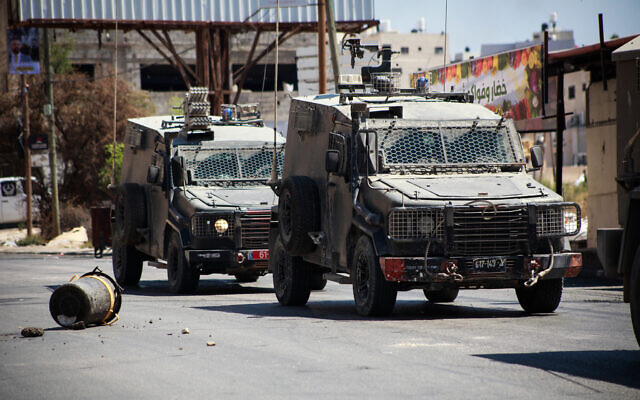 Illustrative: Israeli security forces seen during a raid in the Tubas, in the northern West Bank, August 14, 2024. (Nasser Ishtayeh/Flash90) Illustrative: Israeli security forces seen during a raid in the Tubas, in the northern West Bank, August 14, 2024. (Nasser Ishtayeh/Flash90)