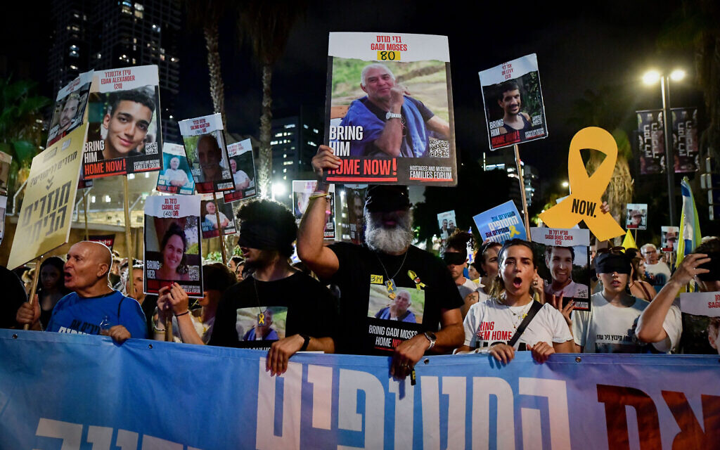 Relatives of Israelis held hostage in Gaza and supporters march calling for the release of Israeli hostages held in the Gaza Strip, in Tel Aviv on August 15, 2024. (Avshalom Sassoni/Flash90)