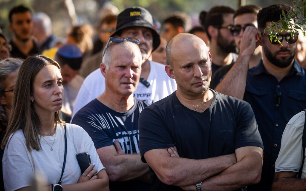 Former prime minister Naftali Bennett attends the funeral service of Avraham Munder at the cemetery in Kibbutz Nir Oz, on August 21, 2024. (Chaim Goldberg/Flash90)
