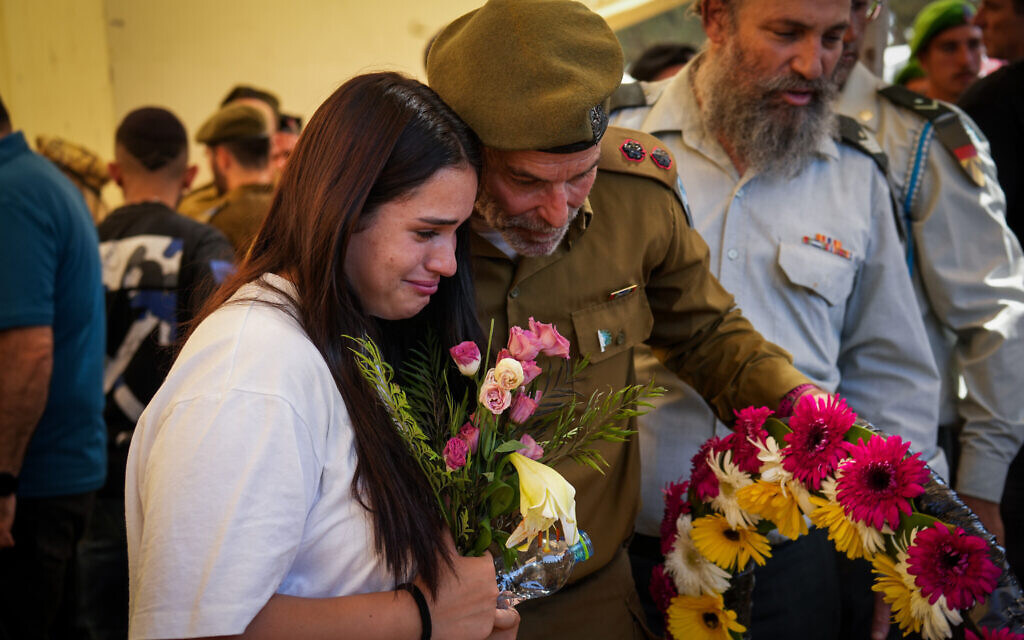Family and friends of IDF Sgt. Ori Ashkenazi Nechemya, killed fighting in southern Gaza, mourn at his funeral in Ashkelon, on August 23, 2024. (Flash90)