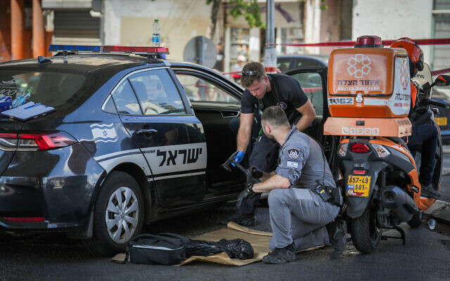 Police at the scene where two Eritrean asylum seekers were killed in a fight that broke out between pro- and anti-regime protesters in south Tel Aviv, August 24, 2024. (Erik Marmor/Flash90) Police at the scene where two Eritrean asylum seekers were killed in a fight that broke out between pro- and anti-regime protesters in south Tel Aviv, August 24, 2024. (Erik Marmor/Flash90)