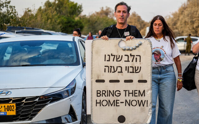 Relatives of Israelis held hostage by Hamas terrorists in Gaza and supporters take part in a rally for the release of Israelis held kidnapped by Hamas terrorists in Gaza, near the Israeli border with the Gaza Strip, on August 28, 2024. (Flash90) Relatives of Israelis held hostage by Hamas terrorists in Gaza and supporters take part in a rally for the release of Israelis held kidnapped by Hamas terrorists in Gaza, near the Israeli border with the Gaza Strip, on August 28, 2024. (Flash90)
