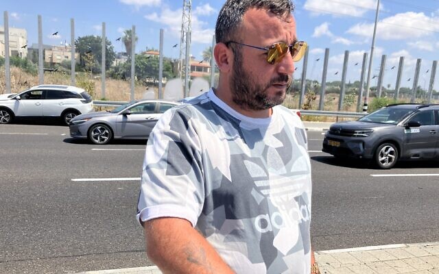 Eyewitness Maor Amsallem at the scene of a Hezbollah drone impact near Nahariya, August 6, 2024. (Diana Bletter/Times of Israel)