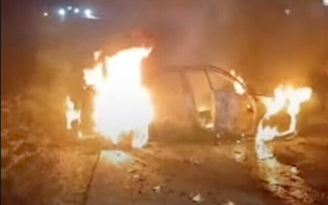 A car torched by masked settlers in the Palestinian town of Jit in the West Bank, August 15, 2024. (Screenshot: X; used in accordance with Clause 27a of the Copyright Law) A car torched by masked settlers in the Palestinian town of Jit in the West Bank, August 15, 2024. (Screenshot: X; used in accordance with Clause 27a of the Copyright Law)