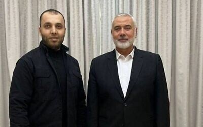 Slain Hamas chief Ismail Haniyeh (R) is seen with bodyguard Wasim Abu Shaaban in an undated photo (Social media)