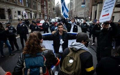 Illustrative: Anti-Israel activists block Jewish students from walking down a street near Columbia University, February 2, 2024. (Luke Tress)