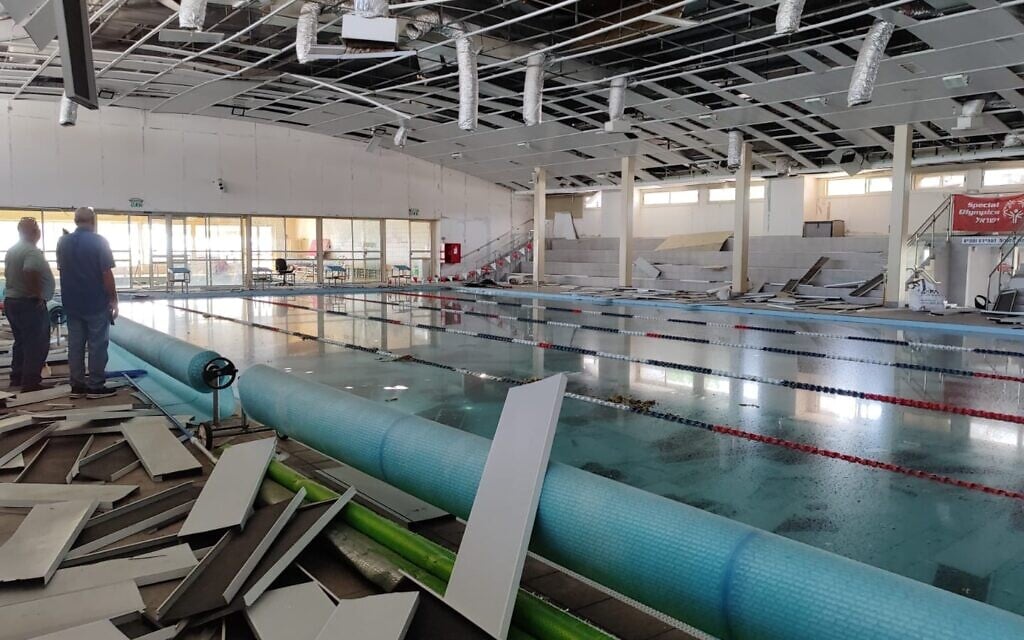 Staff of the Mevo'ot HaHermon Treatment and Rehabilitation Campus examine the damage cause to the hydrotherapy treatment center, on August 13, 2024. (Gavriel Fiske/TOI)