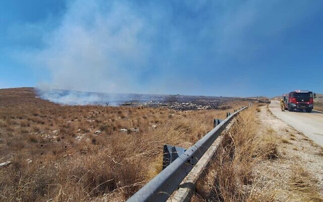 Firefighters work to extinguish a blaze sparked by a Hezbollah rocket attack near Kibbutz Shamir in the Upper Galilee, August 15, 2024. (Israel Fire and Rescue Service) Firefighters work to extinguish a blaze sparked by a Hezbollah rocket attack near Kibbutz Shamir in the Upper Galilee, August 15, 2024. (Israel Fire and Rescue Service)