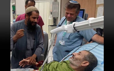 Rescued hostage Farhan al-Qadi seen with family members and doctors at Soroka Medical Center in Beersheba on August 27, 2024. (Courtesy Soroka Medical Center)