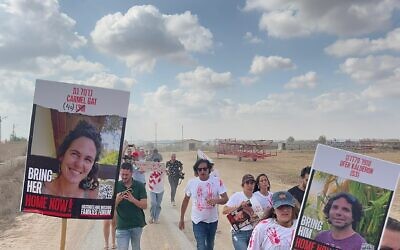 Relatives of hostages run toward the Gaza Strip after passing through the Nirim perimeter fence on August 29, 2024. (Courtesy Hostages and Missing Families Forum)