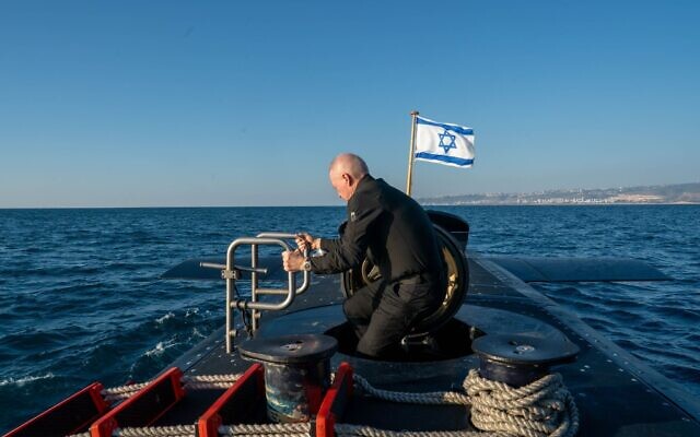 Defense Minister Yoav Gallant is seen on the deck of an Israeli Navy submarine during a drill off the coast of Ashdod, in an image released on August 29, 2024. (Ariel Hermoni/Defense Ministry)
