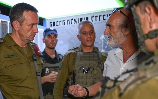 IDF Chief of Staff Herzi Halevi (left) holds a situational assessment at the scene of a deadly terror attack in the West Bank, August 11, 2024. (Israel Defense Forces) IDF Chief of Staff Herzi Halevi (left) holds a situational assessment at the scene of a deadly terror attack in the West Bank, August 11, 2024. (Israel Defense Forces)
