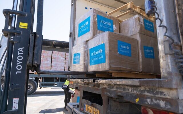 Polio vaccines intended for Gaza are loaded onto trucks at the Kerem Shalom Crossing, August 25, 2024. (Israel Defense Forces)