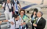 Immigrants arriving from France are greeted by WZO head Yaakov Hagoel, right at Ben Gurion airport on August 27, 2024. (Courtesy)