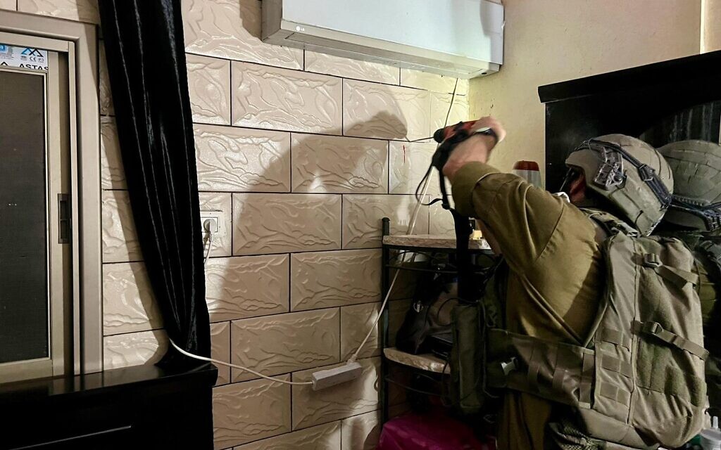 IDF troops measure the home of a Palestinian terrorist in the West Bank town of Baqat al-Hatab near Qalqilya, August 19, 2024. (Israel Defense Forces)