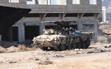 An Israeli Namer APC operates in the Gaza Strip in an image released on August 22, 2024. (Israel Defense Forces)