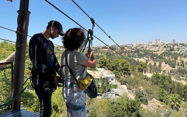 Sue Surkes prepares to dive off the platform and glide along Jerusalem's zipline, Augut 26, 2024. (Courtesy)